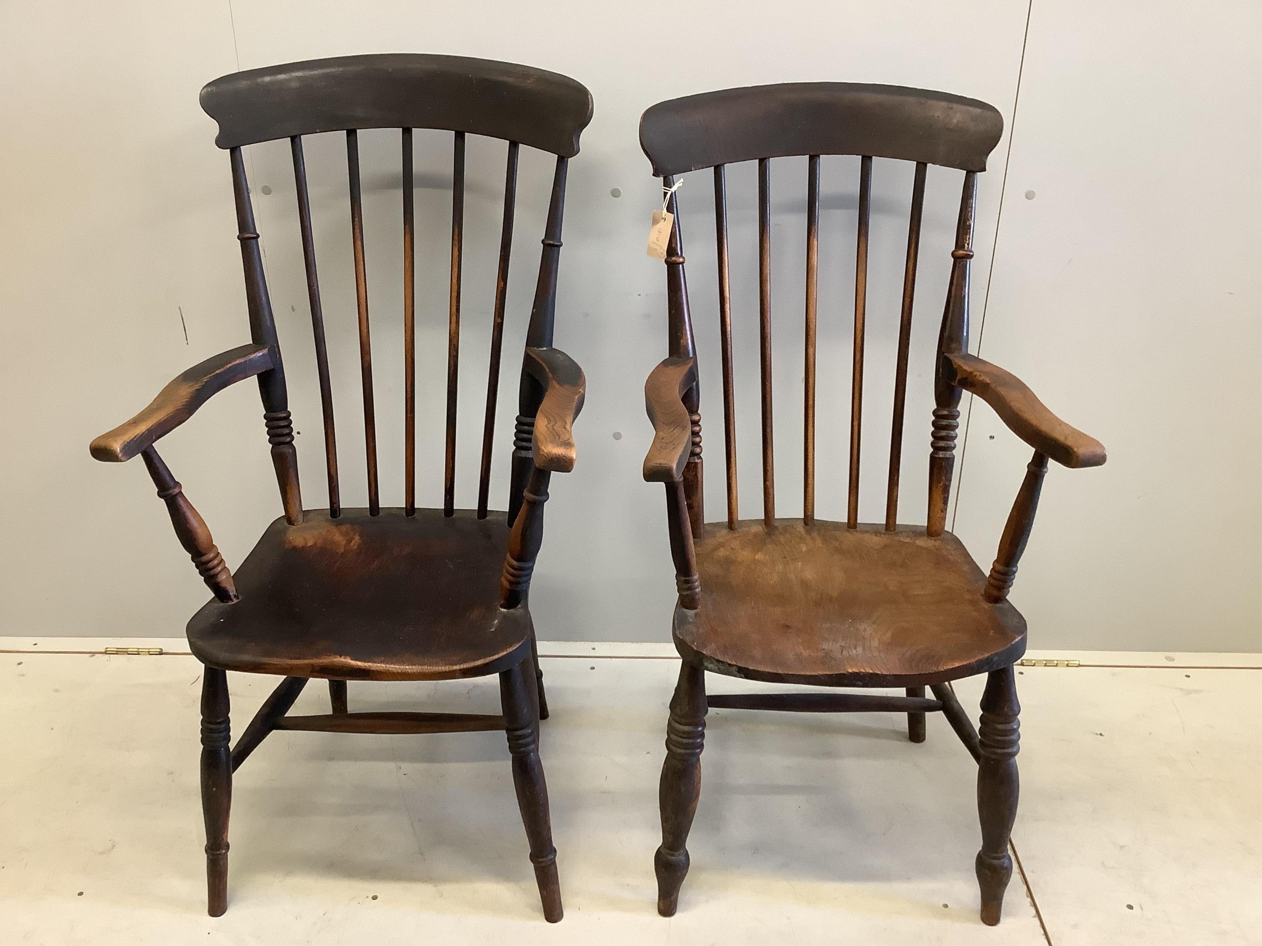 Two Victorian elm and beech Windsor comb back armchairs, larger width 58cm, depth 43cm, height 111cm